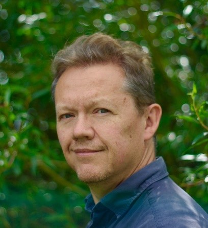 a man smiling outside